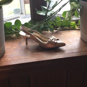 2 and a half inch gold outstanding pumps.